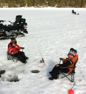 Young boys enjoying ice fishing on Kabetogama Lake