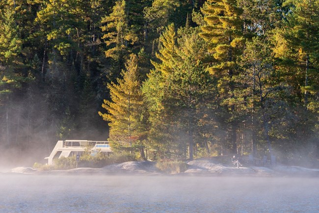 A houseboat on a misty morning