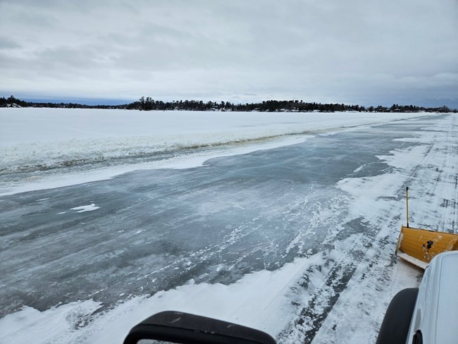 Plowing on Rainy Lake Ice Road