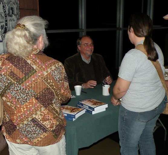 Dr. Paul W. Hutton visiting with guests.