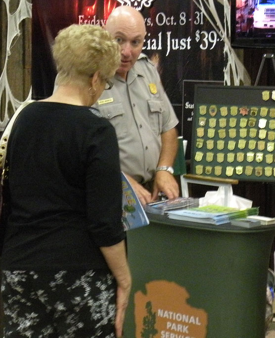 Park Ranger answering visitor questions. Park Ranger answering visitor questions.