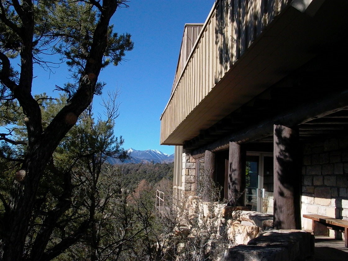 distant view of mountain peaks from Patio of a building - Steve Nycz