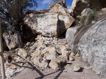 Boulders fallen on trail.