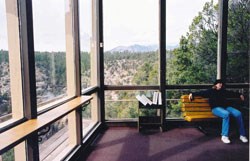 View of canyon and mountains through visitor center windows