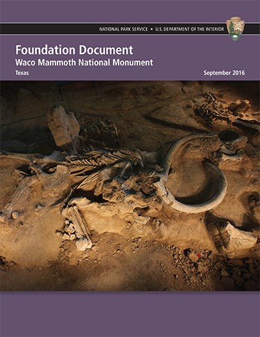 Document cover showing preserved bones and tusks in ground. Title reads "Foundation Document: Waco Mammoth National Monument."