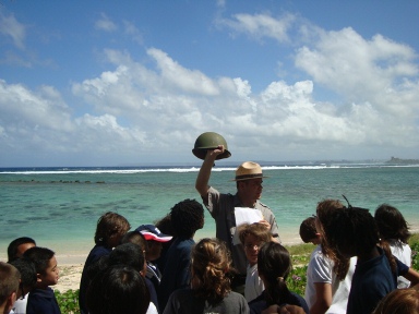 Students and a park ranger at Asan Beach, Guam.