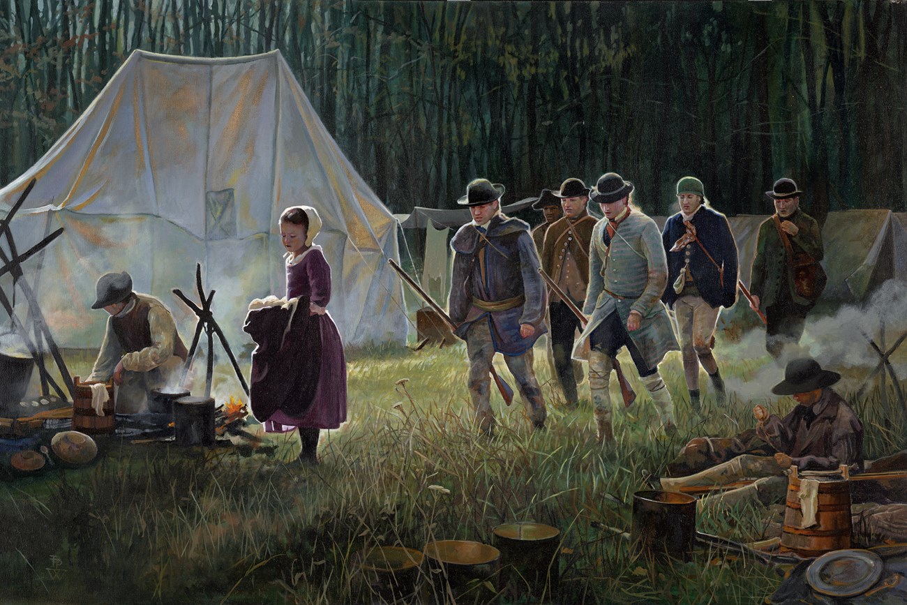 Reenactors soldiers and camp-followers returning to camp