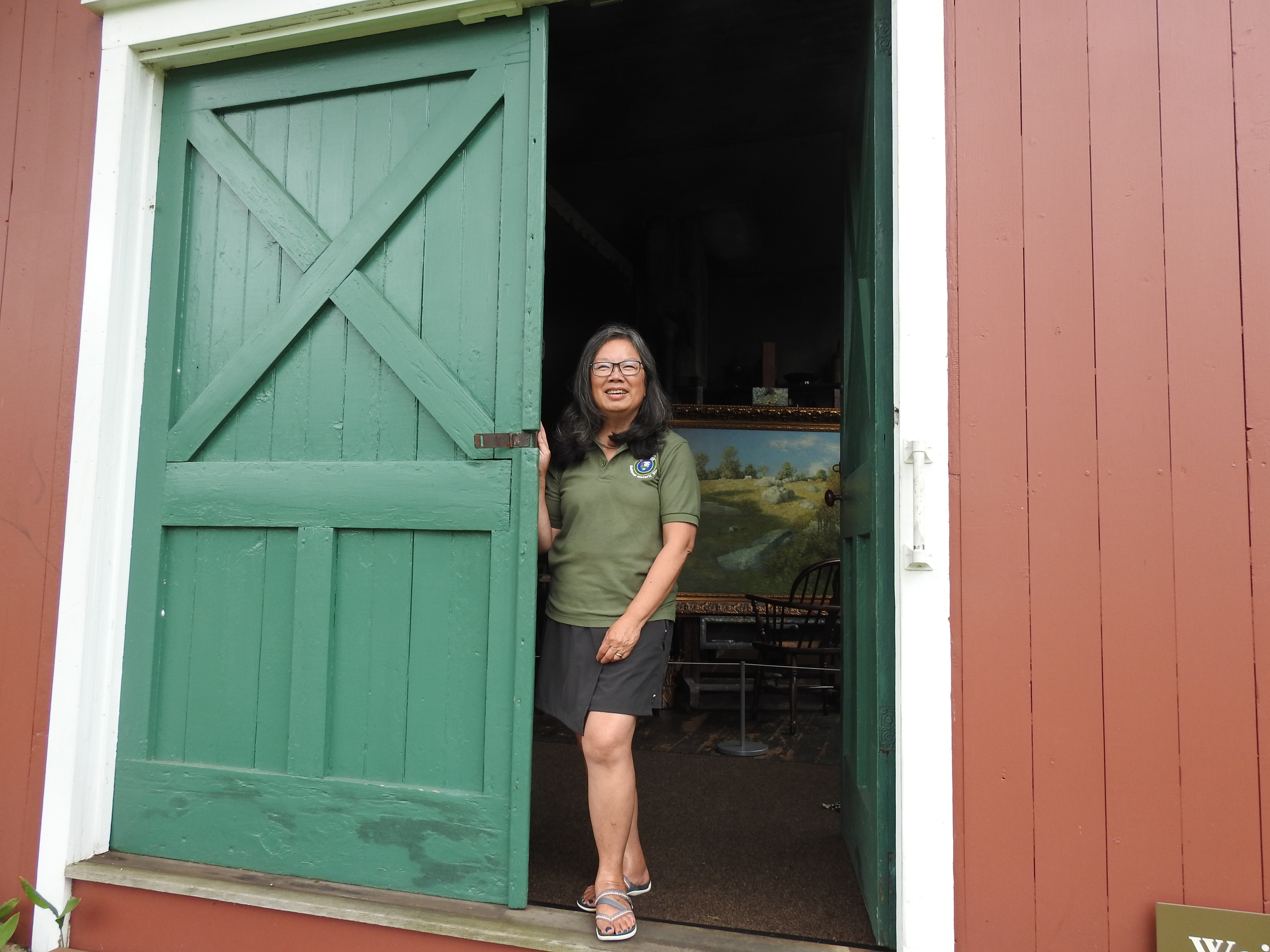 Weir Farm Volunteer Standing in Weir Studio Doorway