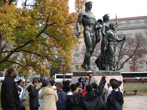 A ranger speaks to a group of people at the Boy Scout Memorial