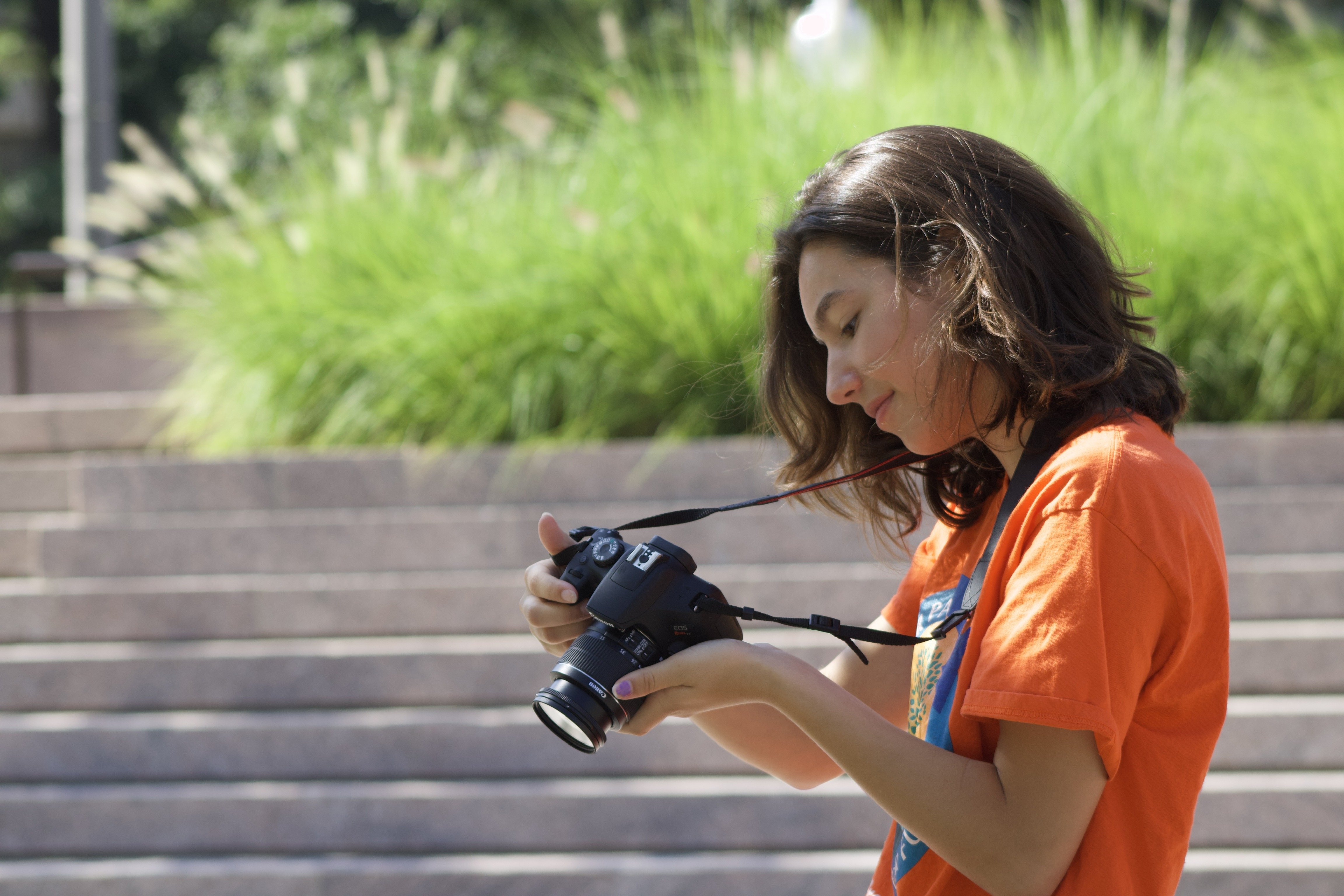 High school student, Nina Fernandez, reviewing a photo during the 2022 Summer Youth Photography Program High school student, Nina Fernandez, reviewing a photo during the 2022 Summer Youth Photography Program
