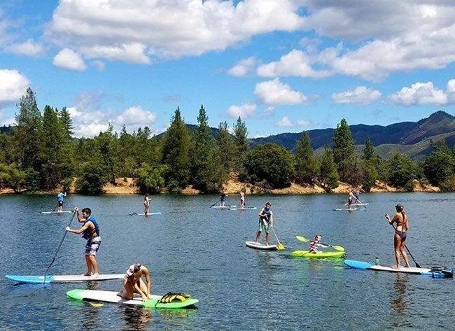 Paddleboards on Whiskeytown Lake. Whiskeytown Marinas rents paddleboards and kayaks at Oak Bottom and Brandy Creek.