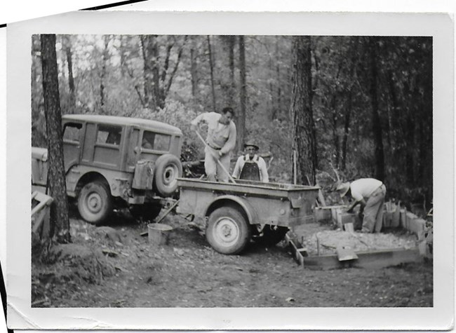 Clint Peltier, his father, Joseph Peltier, and Sally's maternal grandfather, Zip Meelcon, Oct 1949 building shower house.