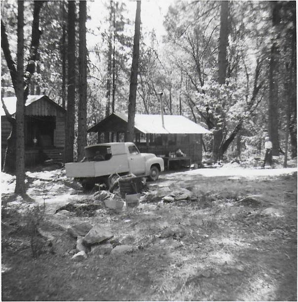 Peltier cabin and cookhouse circa 1950. Black and white photo.