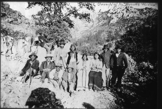 Black and white historic photo of Wintu community members near the McCloud Fish Hatchery in the late 1800s.