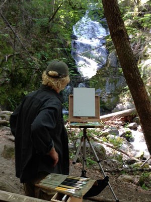 Artist Dave Seibert at the base of Boulder Creek Falls
