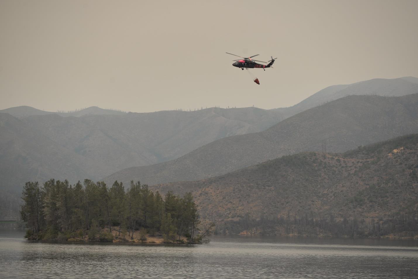 UH-60 Blackhawk (firefighting helicopter) picking up water from Whiskeytown Lake on Tuesday, September 29 UH-60 Blackhawk (firefighting helicopter) picking up water from Whiskeytown Lake on Tuesday, September 29