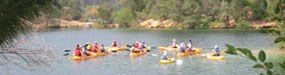 Kayakers listening to ranger on interpretive program Kayakers listening to ranger on interpretive program