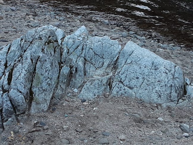 Guardian Rock. Looking at this small boulder sideways, you might see what resembles to be a human head - can you spot the eyes, nose, mouth, and chin?!
