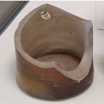 Bottom portion of a broken clay jar. Bottom portion of a broken clay jar.