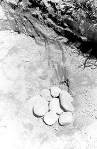 Round stones in hole.