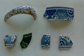 Six sherds. Five with a blue on white pattern. One with a green on white pattern.