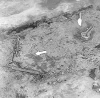 Small pieces of metal before being removed from archeological dig.
