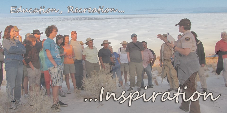 A volunteer ranger speaks to visitors in the dunefield.