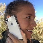 A woman holding a cell phone to her ear