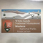 A sign reads “White Sands National Monument, National Parks Association”
