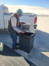 A volunteer helps load a truck