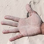 Hand covered with sand