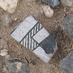 Piece of black and white pottery.