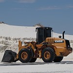 Front loader moving sand.