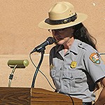 Park Ranger standing behind a podium.