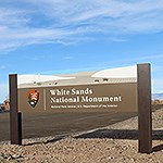 A sign reading "White Sands National Monument"