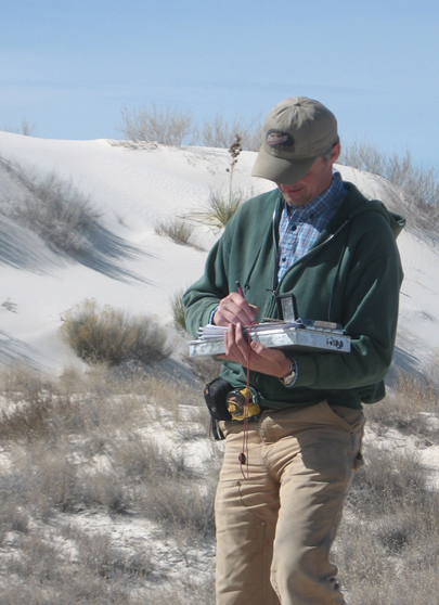 Researcher in the dunes.