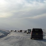 Vehicles driving dunes drive.