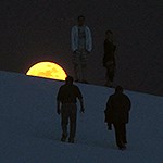 Visitors hiking on the dunes with a full moon rising on the background.