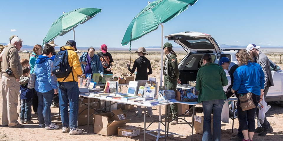 Rangers selling books at Trinity Site. Rangers selling books at Trinity Site.