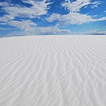 White dune with blue sky above