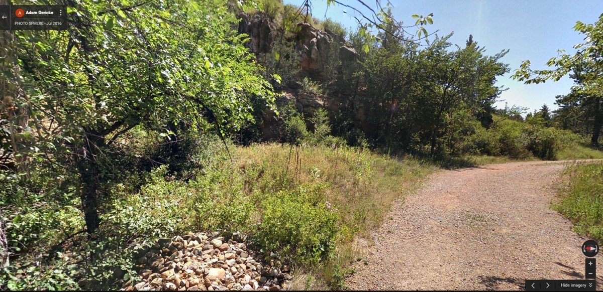 gravel road surrounded by limestone cliffs gravel road surrounded by limestone cliffs