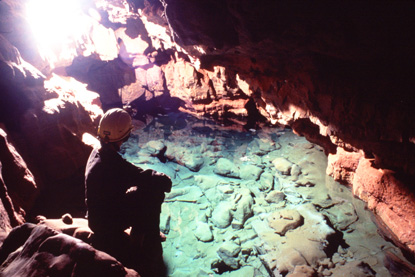 Karen Rosga sits by the shore of Evans Plunge Karen Rosga sits by the shore of Evans Plunge