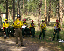 Firefighters attending a briefing before the start of a prescribed burn. Firefighters attending a briefing before the start of a prescribed burn.