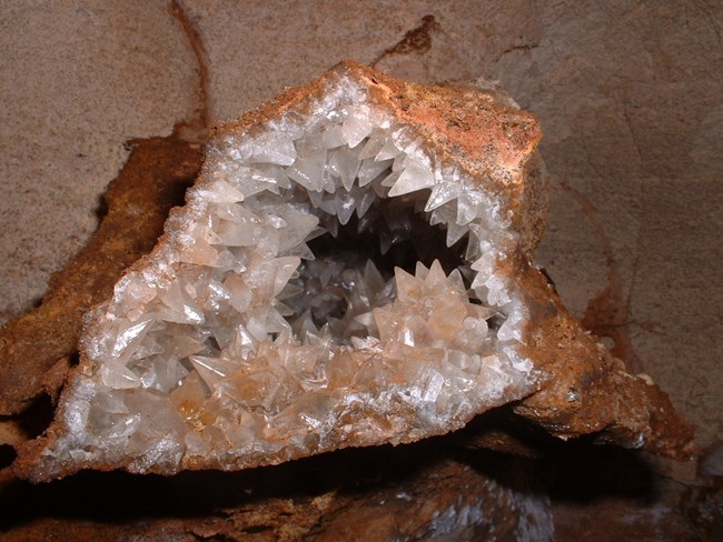 Small calcite crystals glistening inside a vug.