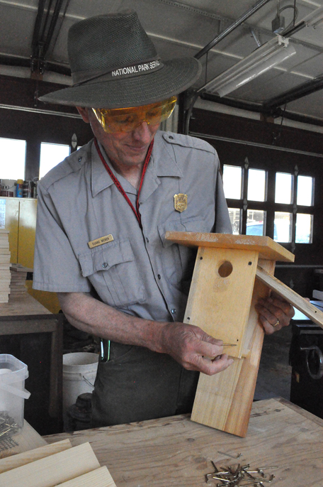 Park BioScience Tech Duane Weber finishes a bird box to be given away.