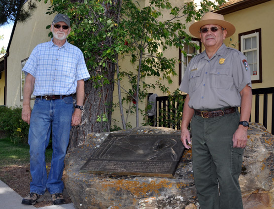 Friends of Wind Cave National Park President Lon Sharp (left) and park Superintendent Vidal Davila after unveiling the Mather Plaque.