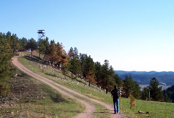 A hiker approaches the Rankin Ridge fire tower, which was constructed in 1956.