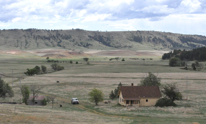 View showing Sanson Ranch buildings with Boland Ridge in the background.