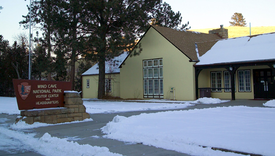 Wind Cave National Park Visitor Center with snow on the ground in front of it.