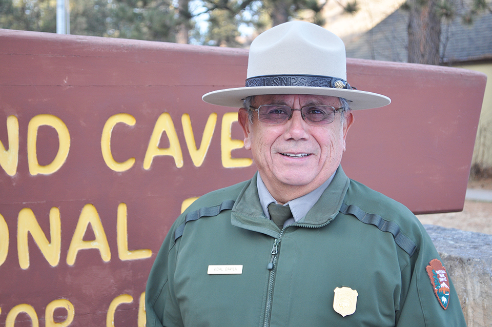 Vidal Davila standing by park sign. Vidal Davila standing by park sign.